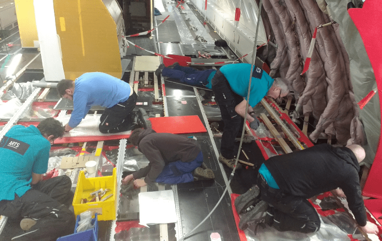 The ARTS Mobile Aircraft Mainbtenance crew at work on the aircraft.